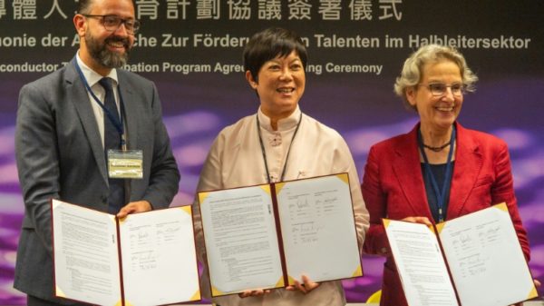 Lora Ho (C), senior vice president of human resources at TSMC, poses with Sebastian Gemkow (L), Saxony state's minister of science, and Ursula Staudinger (R), president of the Dresden University of Technology