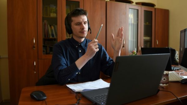 Twice a week, Nazar Danchyshyn flips open his laptop for online classes to help fellow countrymen perfect their Ukrainian speaking skills
