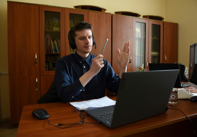 Twice a week, Nazar Danchyshyn flips open his laptop for online classes to help fellow countrymen perfect their Ukrainian speaking skills