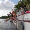 Swimmers leap into the Seine at the Ile Saint-Denis in July