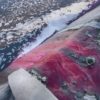 Waste from textile factories is released in a river in India