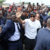 Paris Saint-Germain and France national football team star striker Kylian Mbappe (C) is visiting his father's native Cameroon