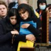 Relatives attend a ceremony at the funeral of the soldier Teodor Osadchyi, killed during the Russian invasion, at Lychakiv cemetery in Lviv, western Ukraine