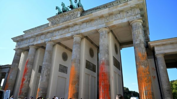 'Last Generation' climate activists said they had sprayed orange warning paint on the six columns of the Brandenburg Gate to call for the phasing out of fossil fuels