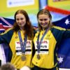 (L-R) Gold medallist Australia's Mollie O'Callaghan and silver medallist Australia's Ariarne Titmus celebrate during the medals ceremony for the women's 200m freestyle swimming event during the World Aquatics Championships