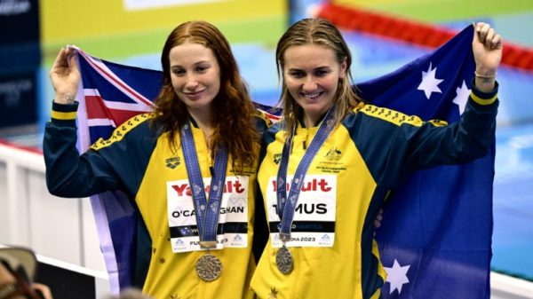 (L-R) Gold medallist Australia's Mollie O'Callaghan and silver medallist Australia's Ariarne Titmus celebrate during the medals ceremony for the women's 200m freestyle swimming event during the World Aquatics Championships