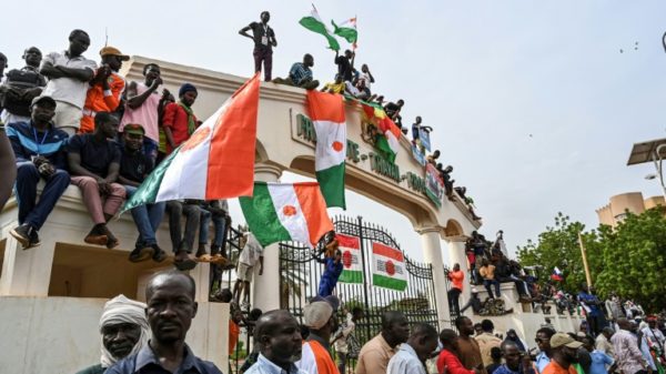 Demonstrators in Niger's capital Niamey chanted slogans hostile to former colonial power France and West African regional bloc ECOWAS