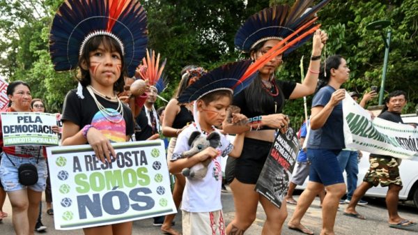 Amazon Indigenous activists and climate campaigners demonstrate on the sidelines of a summit in Belem, Brazil on saving the world's rainforests