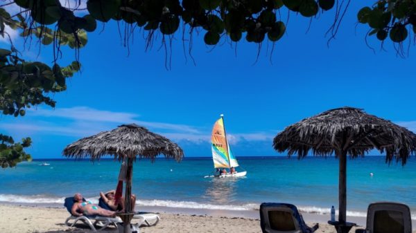 Tourists enjoy the sunshine at Jibacoa Beach, in Cuba's Mayabeque Province, on August 1, 2022; the country says tourism is recovering from a dropoff the last two years