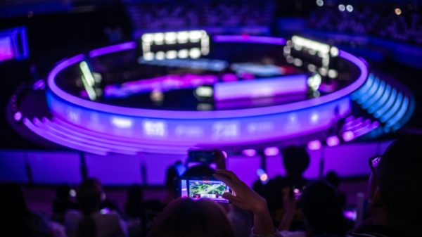 Spectators watch the "Arena of Valor" Asian Games finals