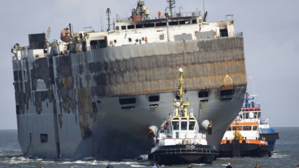 The fire-stricken ship was carrying more than 3,700 vehicles including almost 500 electric cars